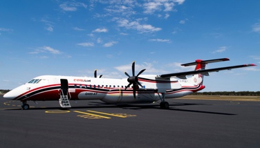A large plane is stationery on a runway
